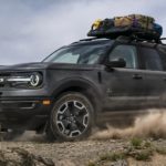 A black 2022 Ford Bronco Sport is shown from the front at an angle while off-roading.