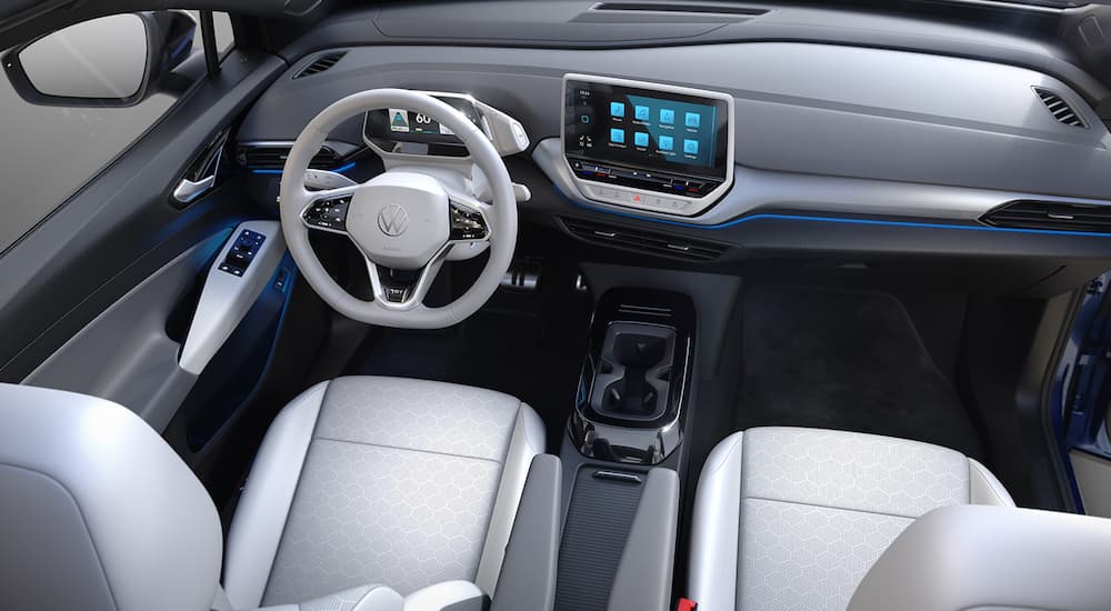 The white interior of a 2022 Volkswagen ID.4 is shown from a high angle.