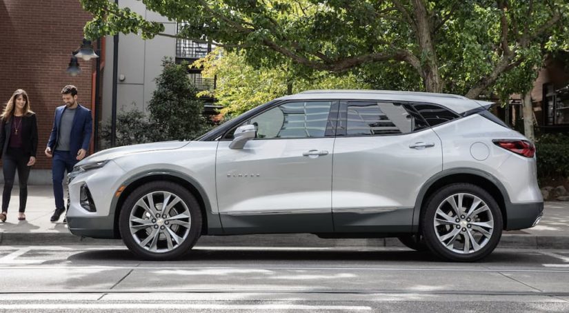 A white 2022 Chevy Blazer is shown from the side during a 2022 Chevy Blazer vs 2022 Honda Passport comparison.