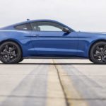 A blue 2022 Ford Mustang Stealth Edition is shown from the side on a runway after leaving a Gunnison Ford dealer.