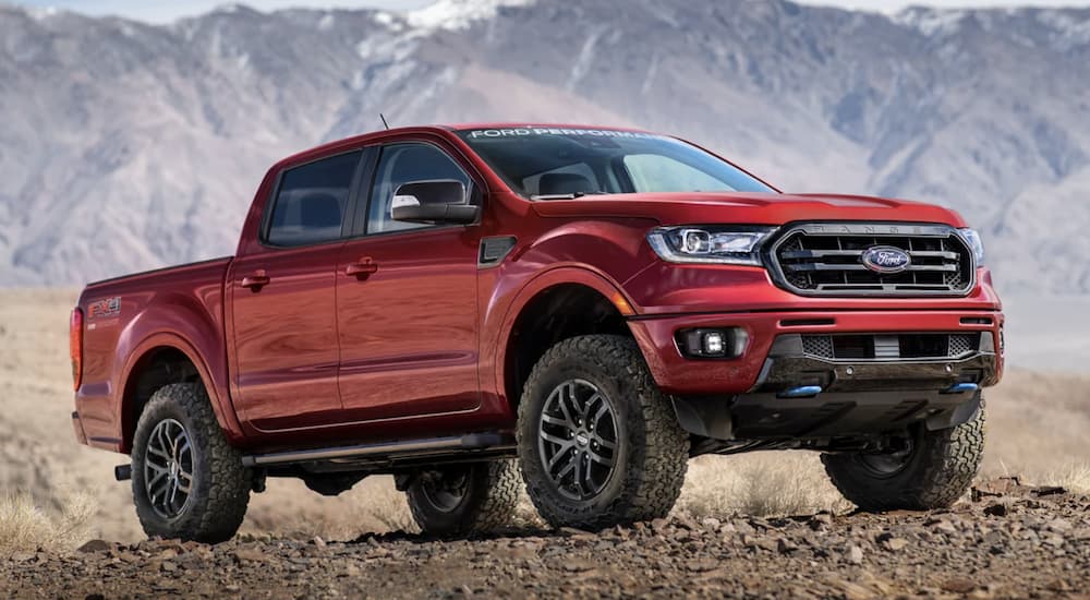 A red 2022 Ford Ranger is shown parked in the mountains.