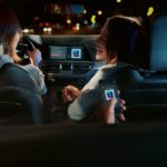 Friends are shown hanging out in a 2022 BMW 3 Series listening to music.