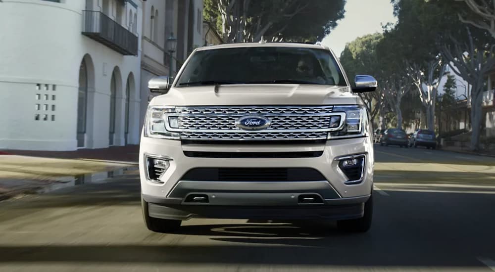 A white 2022 Ford Expedition is shown from the front in a suburban area.