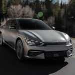 A grey 2022 Kia EV6 is shown from the front while driving down the road after leaving one of the Philadelphia Kia dealers.