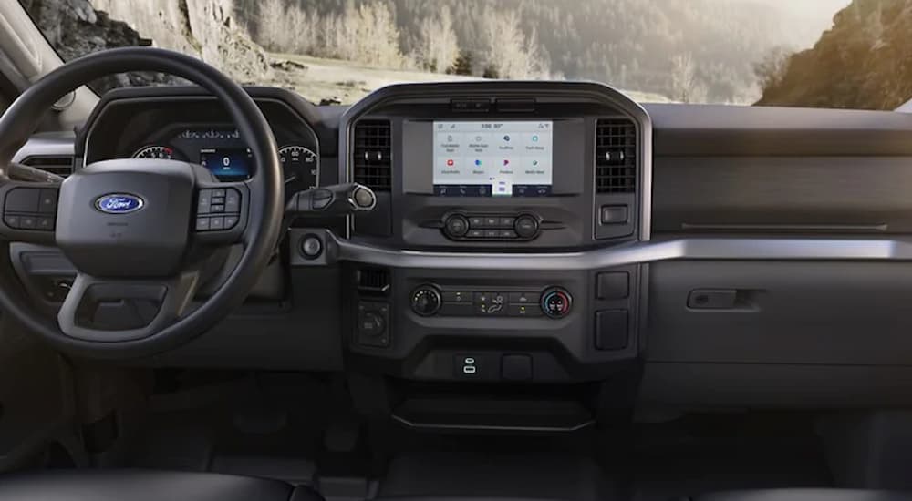 The dashboard and steering wheel of a 2022 F-150 XL is shown.