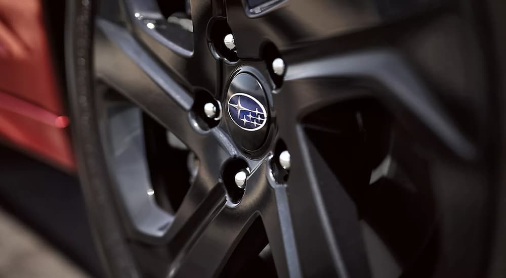 A close up shows the black wheel on a 2022 Subaru Legacy.
