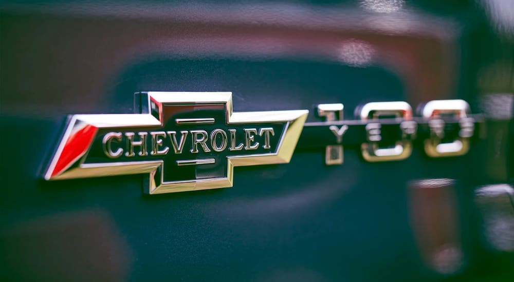 A close up shows the 100 year anniversary Chevy bowtie logo.