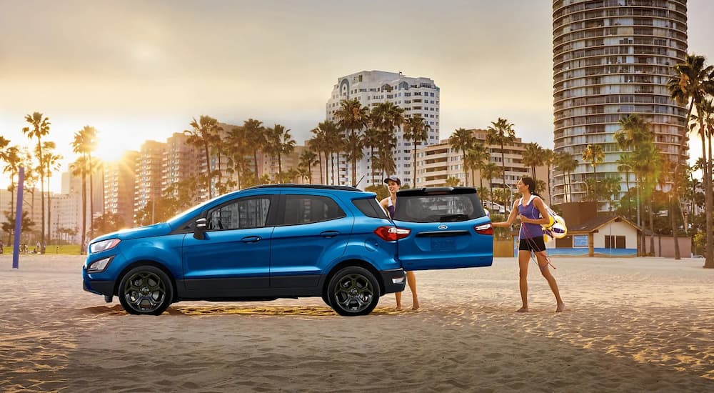 A blue 2022 Ford EcoSport is shown from the side parked on the back after leaving a Ford dealership.