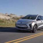 A silver 2023 Chevy Bolt EUV is shown from the front at an angle on the road.