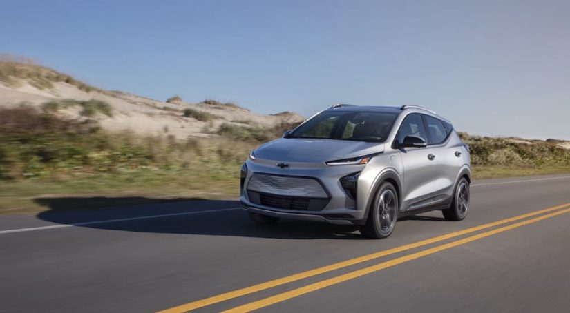 A silver 2023 Chevy Bolt EUV is shown from the front at an angle on the road.