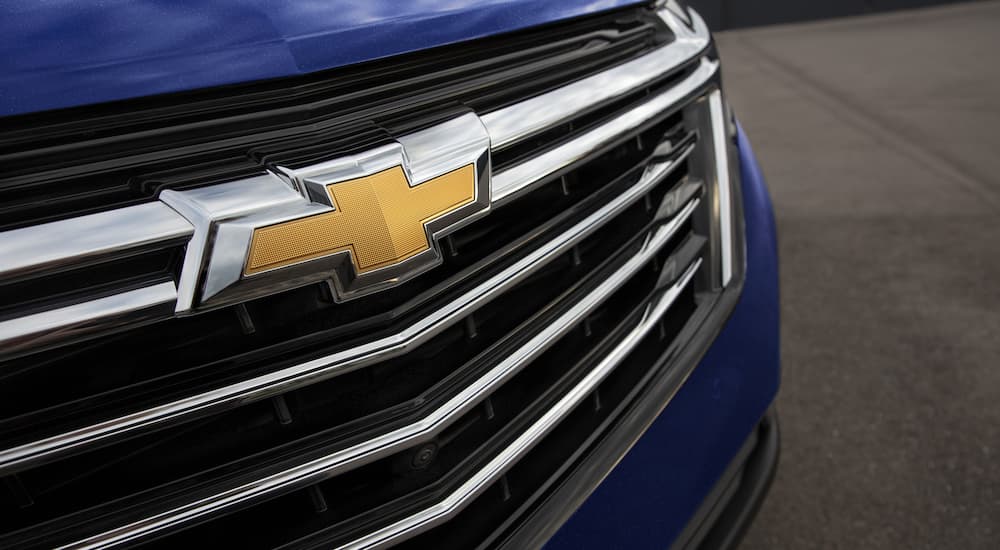 A close up of the grille on a blue 2022 Chevy Equinox LS is shown.
