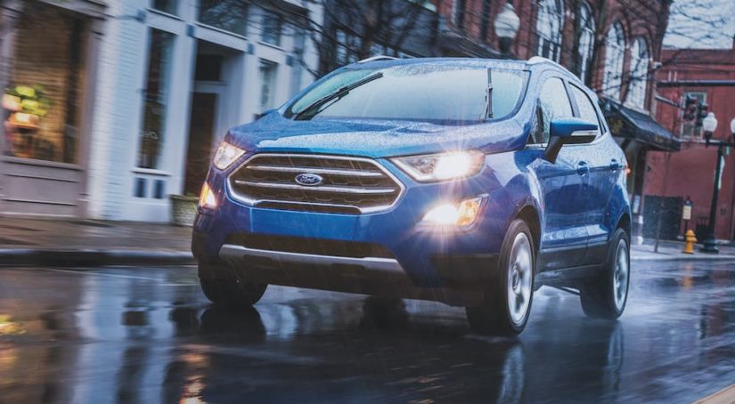 A blue 2022 Ford Ecosport is shown from the front at an angle in the rain.
