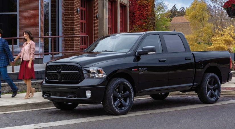 A black 2022 Ram 1500 Classic is shown parked on the side of a city street.