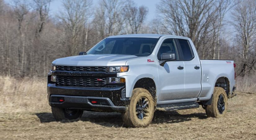 A grey 2022 Chevy Silverado 1500 Custom Trail Boss is shown from the front at an angle.
