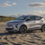 A silver 2023 Chevy Bolt EUV is shown from the side at an angle while parked on a beach.