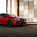 A red 2022 Mercedes-Benz A-Class is shown in front of a modern wall.