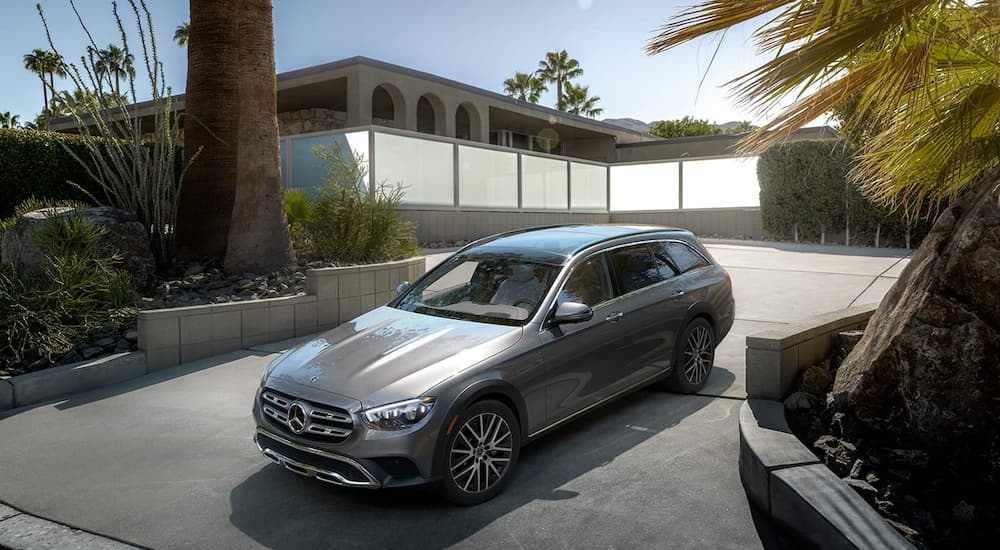 A silver 2022 Mercedes-Benz E-Class is shown parked in a driveway.