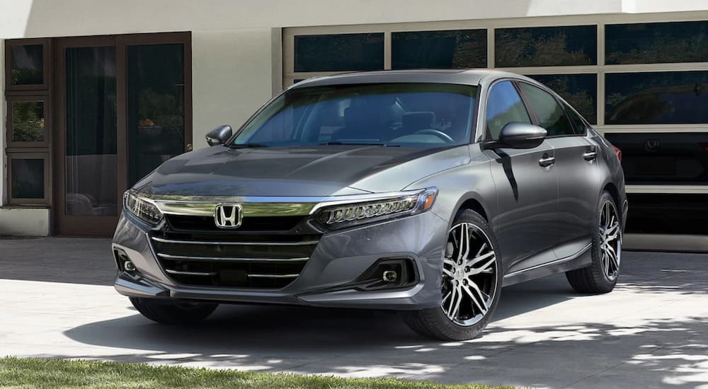 A grey 2022 Honda Accord 2.0T is shown from the front parked in a driveway.