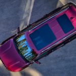 A red 2023 Wagoneer L is shown from a high angle.