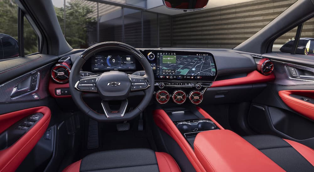 The red interior of a 2024 Chevy Blazer EV is shown from the drivers seat.