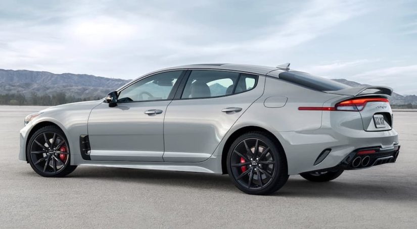 A grey 2022 Kia Stinger GT is shown from the side after leaving a car dealer near you.