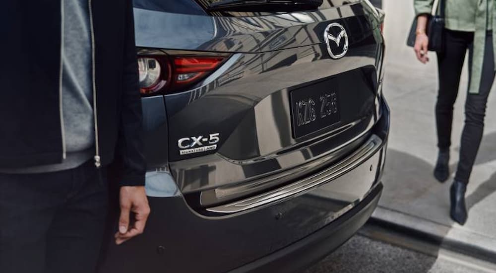 A close up of the lift gate on a grey 2023 Mazda CX-5 is shown.