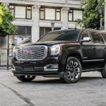 A black 2018 GMC Yukon Denali Ultimate is shown on a lot after leaving a used GMC dealer.