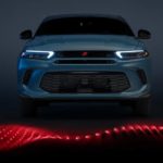 A blue 2023 Dodge Hornet is shown from the front.