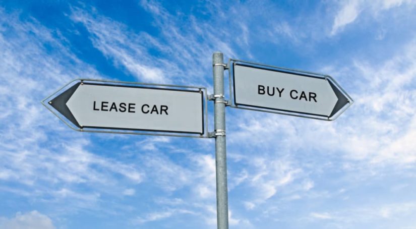Two signs that say 'lease car' and 'buy car' are shown.