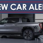 A grey 2024 GMC Sierra EV Denali is shown charging under a new car alert banner.