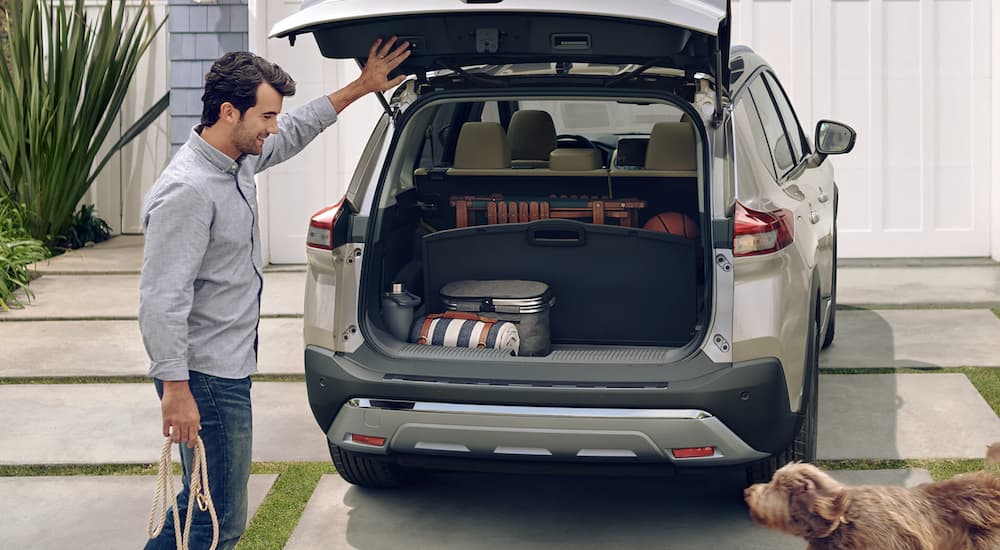 A grey 2023 Nissan Rogue is shown with the liftgate open.