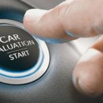 A hand is shown pressing a button to 'value my trade.'