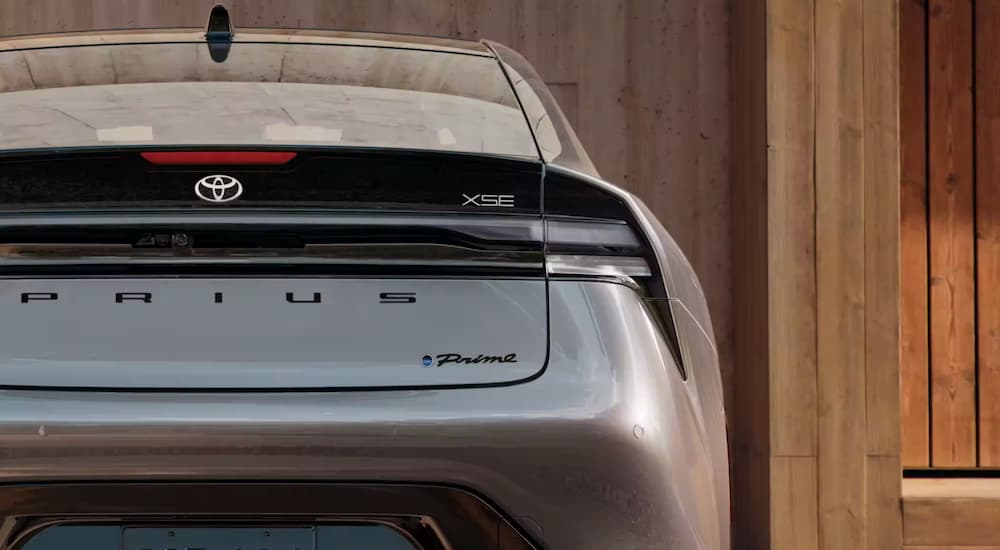 A close up shows the rear end of a silver 2023 Toyota Prius Prime XSE Premium.