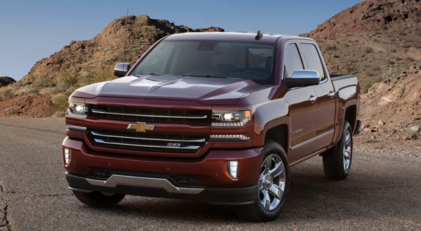 A red 2017 Chevy Silverado 1500 Z71 is shown parked in the mountains.