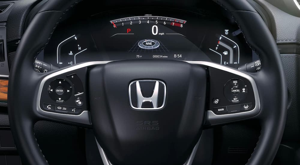 A close up of the steering wheel on a 2022 Honda CR-V is shown.