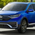 A blue 2021 Honda CR-V is shown from the front after leaving a dealer that handles online Honda CR-V sales.