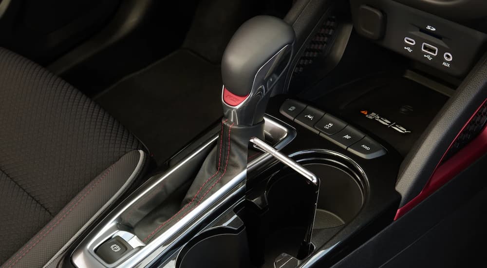 A close up shows the center console and shifter in a 2023 Chevy Trailblazer RS.