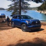 A blue 2023 Toyota Sequoia is shown from the front at an angle.