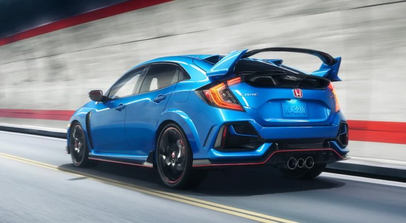 A blue 2020 Honda Civic Type R is shown from the rear at an angle.