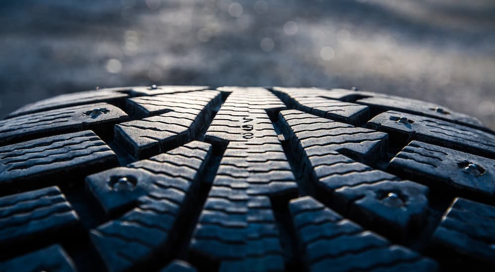 A close up of the treads on a winter tire are shown.