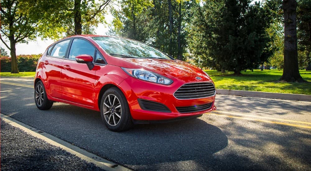 A red 2015 Ford Fiesta is shown from the front at an angle after leaving a used Ford dealer.