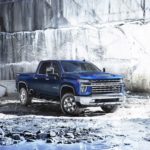 A blue 2023 Chevy Silverado 2500 HD is shown from the front at an angle.