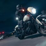 A person is shown riding on a black and white 2023 Harley-Davidson Low Rider S.