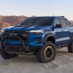 A blue 2023 Chevy Colorado ZR2 Desert Boss is shown from the front at an angle.
