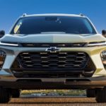 A green 2024 Chevy Trax is shown from the front.