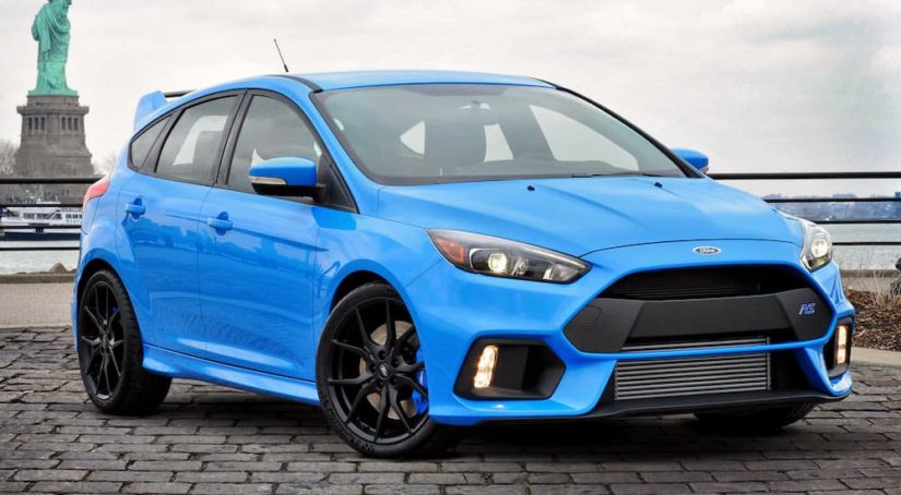 A blue 2016 Ford Focus RS is shown from the front at an angle.