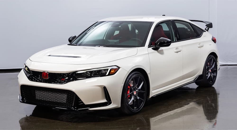 A white 2023 Honda Civic Type R is shown from the front at an angle.