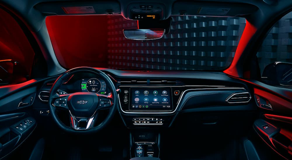 The black interior of a 2023 Chevy Bolt EUV Redline is shown from the center console.
