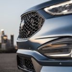 A close up of the front of a blue 2023 Ford Edge ST is shown.