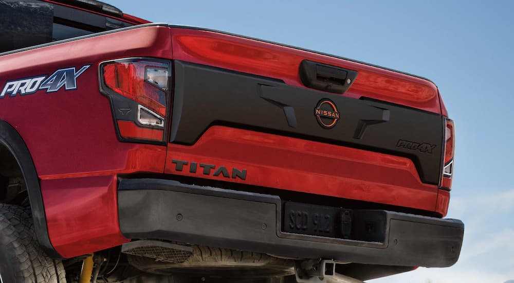 A close up of the liftgate on a red 2023 Nissan Titan Pro-4x is shown.
